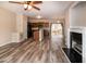 Open concept living room, kitchen, and island with hardwood floors at 496 Omaha Dr, Broadway, NC 27505