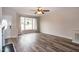 Living room with hardwood floors, fireplace, and access to deck at 496 Omaha Dr, Broadway, NC 27505