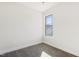 Well-lit bedroom featuring grey carpet and a window with an exterior view at 502 Randolph Dr, Clayton, NC 27520