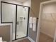 Bathroom with walk in shower and linen closet at 5112 N River Sand Trl, Raleigh, NC 27604