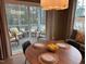 Dining area with sliding glass doors to screened porch at 5112 N River Sand Trl, Raleigh, NC 27604
