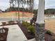 Landscaped front yard with walkway and stone pillars at 5112 N River Sand Trl, Raleigh, NC 27604