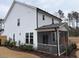 Two-story house with screened porch and landscaped yard at 5112 N River Sand Trl, Raleigh, NC 27604