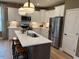Modern kitchen with white cabinets and quartz countertops at 5112 N River Sand Trl, Raleigh, NC 27604