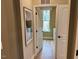 Convenient laundry room with washer, dryer, and ample shelving at 5112 N River Sand Trl, Raleigh, NC 27604