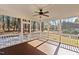 Relaxing screened porch featuring a wood floor, ceiling fan, and view of the backyard at 5637 Turner Glen Dr, Raleigh, NC 27603