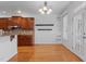 Dining area with chandelier, wood cabinets, and views of backyard at 5637 Turner Glen Dr, Raleigh, NC 27603