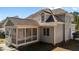 Exterior view of home featuring screened porch, neutral siding, and brick foundation at 5637 Turner Glen Dr, Raleigh, NC 27603