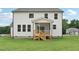 Back of house featuring a screened-in porch with a wooden deck and stairs at 92 Frost Meadow Way, Lillington, NC 27546