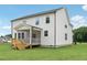 Exterior of home showcasing a screened-in porch and wooden deck at 92 Frost Meadow Way, Lillington, NC 27546
