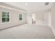 Spacious bedroom featuring neutral carpet, two windows, and trim at 92 Frost Meadow Way, Lillington, NC 27546