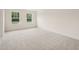 Bedroom with carpet flooring and windows providing natural light at 92 Frost Meadow Way, Lillington, NC 27546