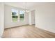 Charming dining room filled with natural light and elegant hardwood floors at 92 Frost Meadow Way, Lillington, NC 27546