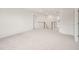 Bright hallway with carpet flooring and staircase, leading to other rooms at 92 Frost Meadow Way, Lillington, NC 27546