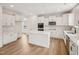 Bright kitchen featuring an island, stainless steel appliances, and white cabinets at 92 Frost Meadow Way, Lillington, NC 27546