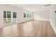 Bright living room featuring hardwood floors, large windows and access to the outdoor deck at 92 Frost Meadow Way, Lillington, NC 27546