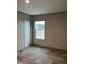 Bright bedroom with vinyl flooring and a window at 1039 Branch Chapel Church Rd, Selma, NC 27576