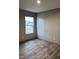 Bright bedroom with vinyl flooring and a window at 1039 Branch Chapel Church Rd, Selma, NC 27576