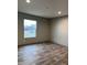Spacious bedroom with large window and vinyl flooring at 1039 Branch Chapel Church Rd, Selma, NC 27576