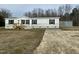 Single-wide manufactured home with detached shed and gravel driveway at 1039 Branch Chapel Church Rd, Selma, NC 27576