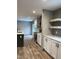 Modern kitchen with white cabinets and stainless steel appliances at 1039 Branch Chapel Church Rd, Selma, NC 27576