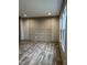 Living room featuring wood-look flooring and an accent wall at 1039 Branch Chapel Church Rd, Selma, NC 27576