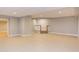 Finished basement with tile floors and staircase at 10825 Ashland Mill Ct, Raleigh, NC 27617