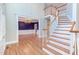 Hardwood floors, staircase, and views into the dining room at 10825 Ashland Mill Ct, Raleigh, NC 27617