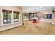 Spacious basement featuring a stone accent wall, high ceilings, and a classic bubble hockey table at 11201 Jonas Ridge Ln, Raleigh, NC 27613
