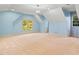 Large carpeted bedroom featuring light blue walls, recessed lighting, and bright, natural light at 11201 Jonas Ridge Ln, Raleigh, NC 27613