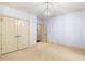 Carpeted bedroom featuring light blue walls, recessed lighting, and access to closet space at 11201 Jonas Ridge Ln, Raleigh, NC 27613