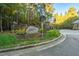 Gated community entrance with stonework and landscaping at 11201 Jonas Ridge Ln, Raleigh, NC 27613