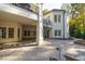Stately white brick home boasts a covered patio with spiral staircase at 11201 Jonas Ridge Ln, Raleigh, NC 27613