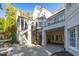 Beautifully designed white brick home features a spiral staircase and covered patio at 11201 Jonas Ridge Ln, Raleigh, NC 27613