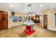 Entertainment room featuring a Super Chexx game table, TV, and access to a bar area at 11201 Jonas Ridge Ln, Raleigh, NC 27613