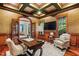 Spacious home office with wood-paneled walls and built-in shelving at 11201 Jonas Ridge Ln, Raleigh, NC 27613