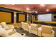 Enjoy movie nights in this home theater, complete with tiered seating and a large screen at 11201 Jonas Ridge Ln, Raleigh, NC 27613