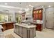 Eat-in kitchen with granite countertops, stainless steel appliances, and an island at 11201 Jonas Ridge Ln, Raleigh, NC 27613