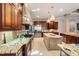 Spacious kitchen boasts granite countertops, stainless steel appliances, and an island at 11201 Jonas Ridge Ln, Raleigh, NC 27613
