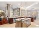 Open kitchen features large island, granite countertops, and stainless steel appliances at 11201 Jonas Ridge Ln, Raleigh, NC 27613