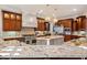 Gourmet kitchen with granite counters and stainless steel appliances at 11201 Jonas Ridge Ln, Raleigh, NC 27613