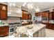 Spacious kitchen with granite island and high-end appliances at 11201 Jonas Ridge Ln, Raleigh, NC 27613