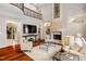 Elegant living room featuring hardwood floors, fireplace, and high ceilings at 11201 Jonas Ridge Ln, Raleigh, NC 27613