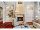 Living room with large fireplace and built-in shelving at 11201 Jonas Ridge Ln, Raleigh, NC 27613