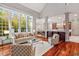 Open living room with kitchen views and hardwood floors at 11201 Jonas Ridge Ln, Raleigh, NC 27613