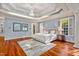 Spacious main bedroom with hardwood floors and large windows at 11201 Jonas Ridge Ln, Raleigh, NC 27613