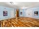 Spacious room with decorative hardwood floor at 11201 Jonas Ridge Ln, Raleigh, NC 27613