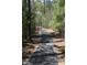 Picturesque community walking trail shaded by mature trees at 11201 Jonas Ridge Ln, Raleigh, NC 27613