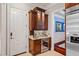 Built-in wet bar with wine cooler and granite countertop at 11201 Jonas Ridge Ln, Raleigh, NC 27613