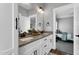 Elegant bathroom features a granite countertop, white cabinets, and modern fixtures at 1178 Sheriff Johnson Rd, Lillington, NC 27546